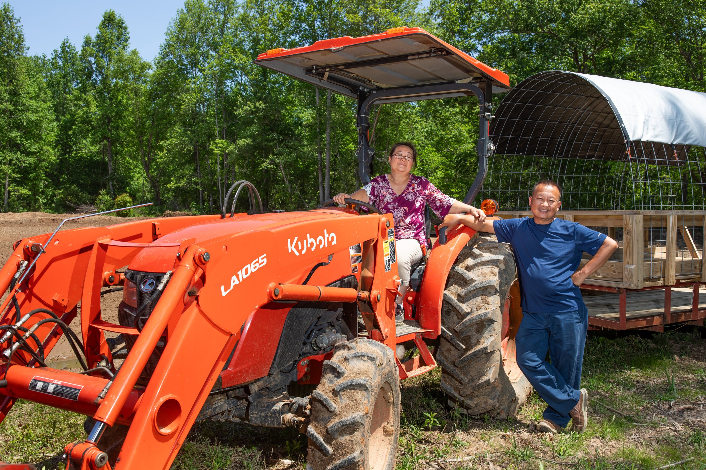 Lee's One Fortune Farm growers with their tractor